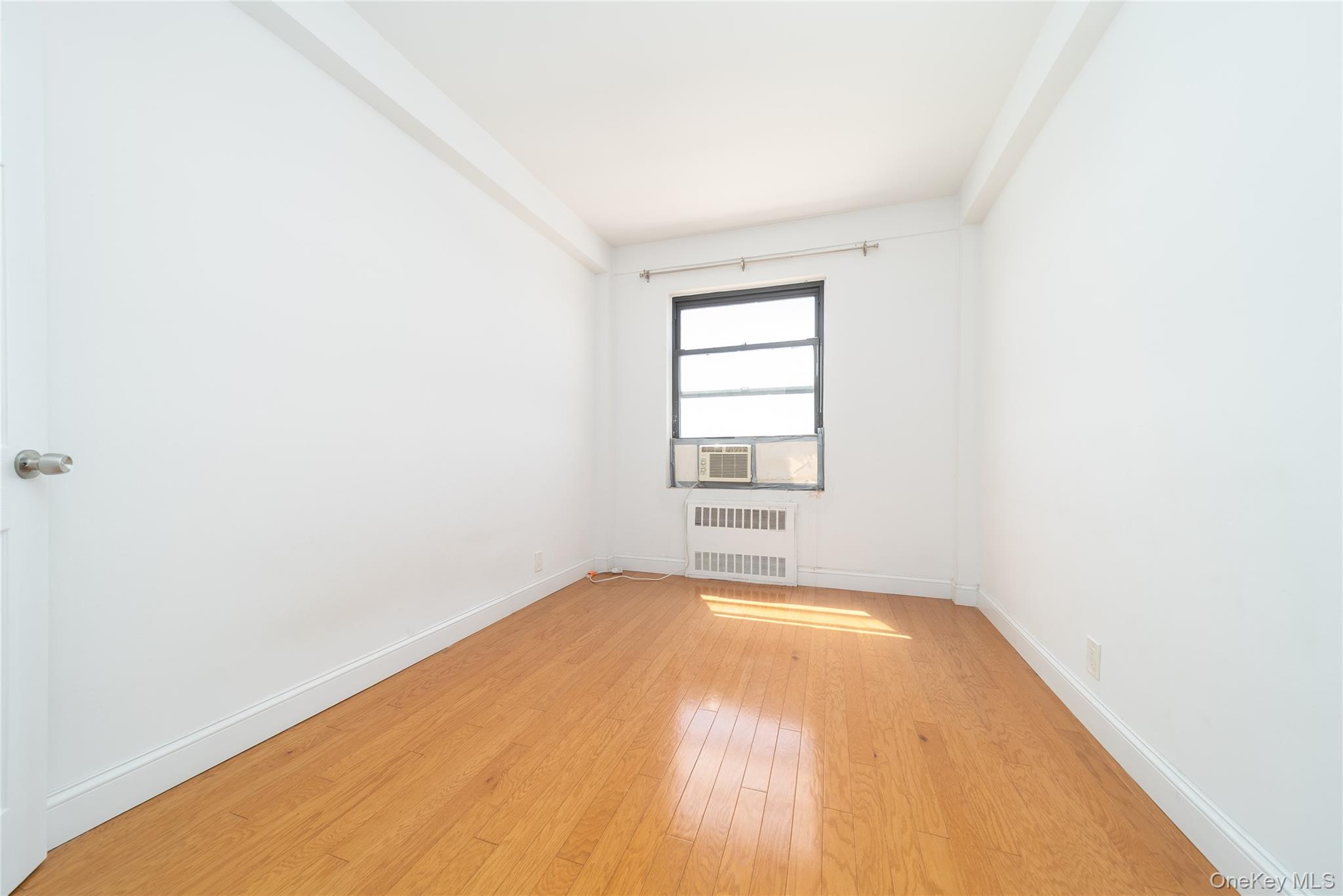 99-32 66th Road, Unit 9N Queens, NY 11374 - Photo 11 of 16 a view of a room with windows