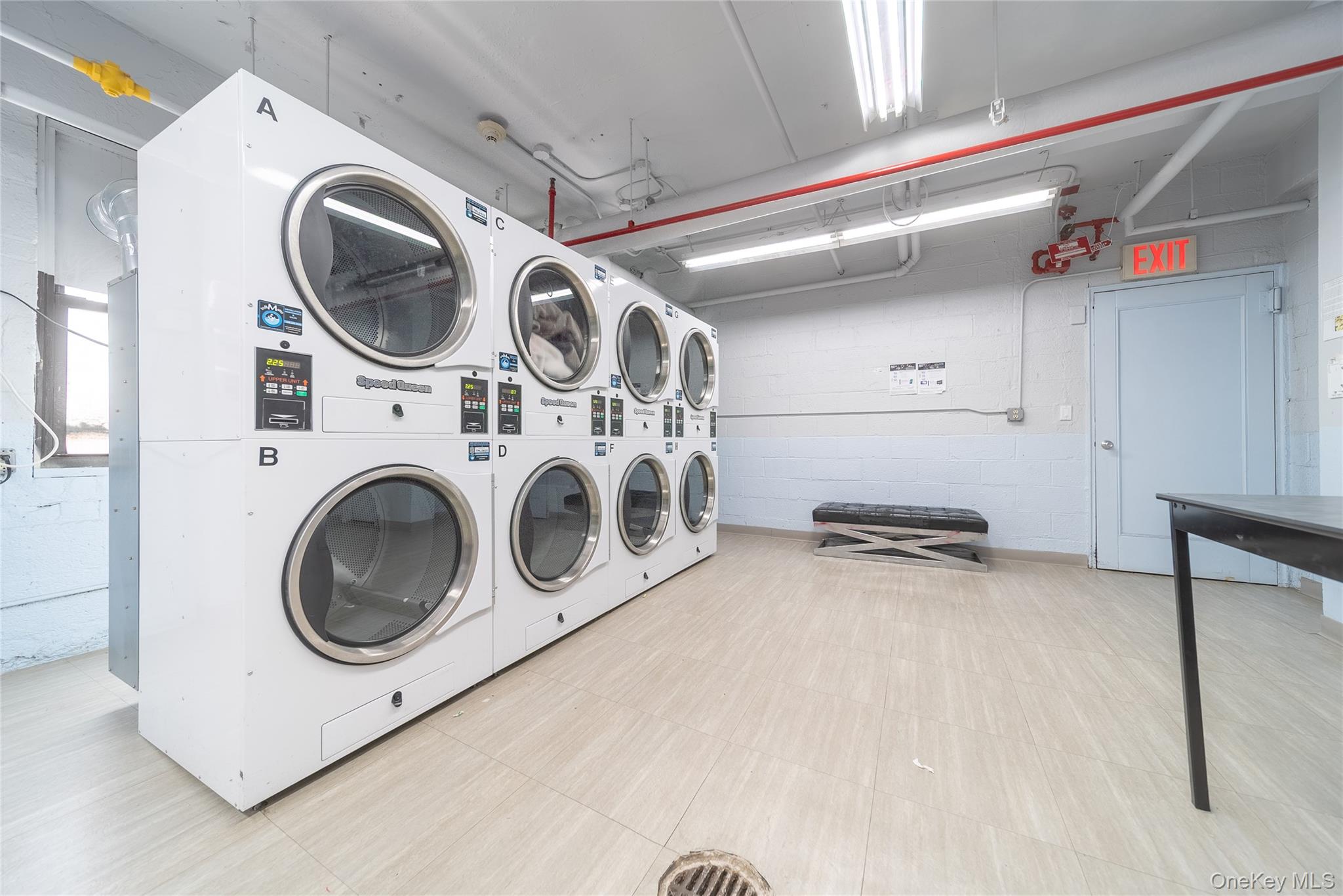 99-32 66th Road, Unit 9N Queens, NY 11374 - Photo 14 of 16 a utility room with dryer and washer