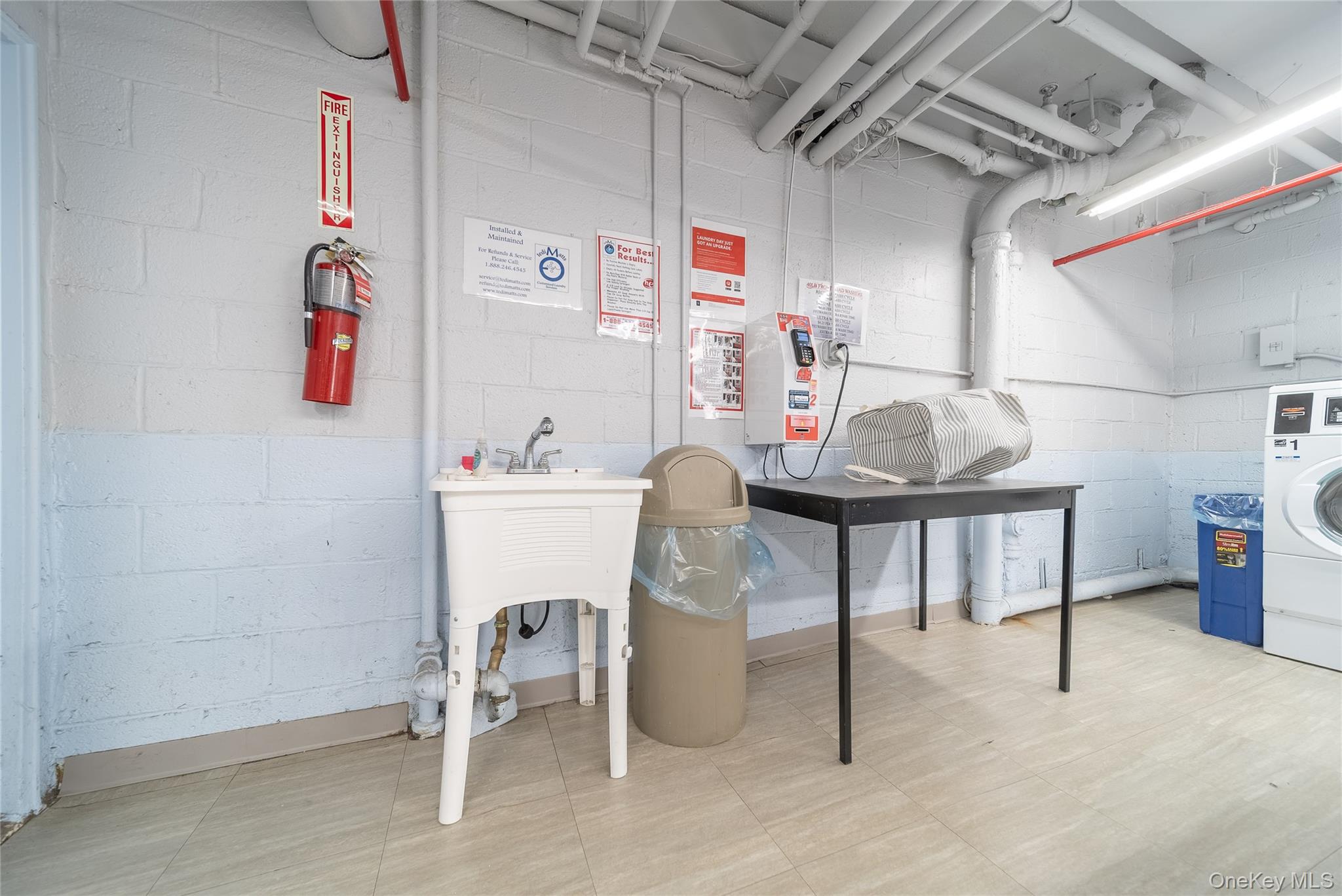 99-32 66th Road, Unit 9N Queens, NY 11374 - Photo 15 of 16 a room with storage and furniture