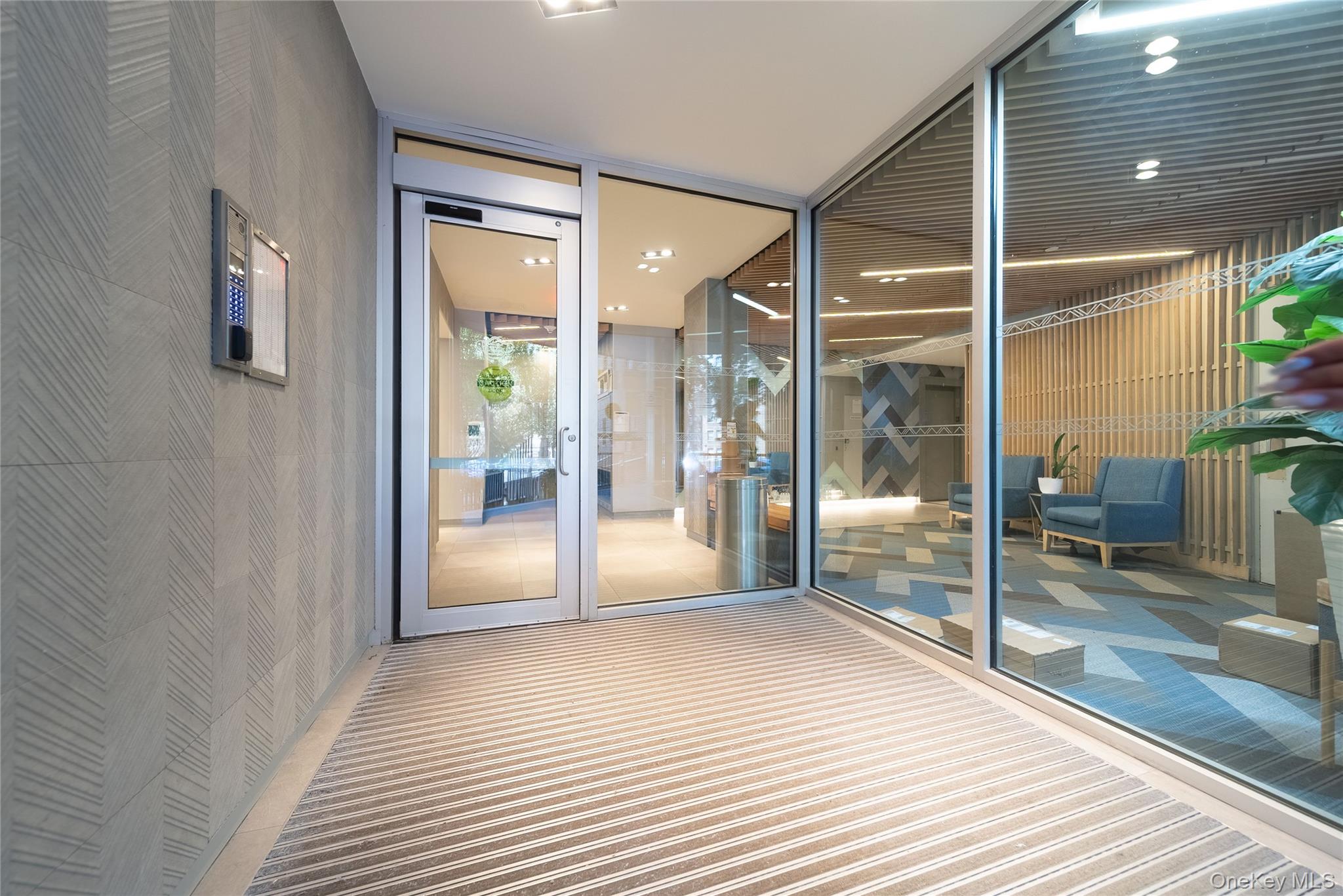 99-32 66th Road, Unit 9N Queens, NY 11374 - Photo 3 of 16 a bathroom with a glass door shower and a sink
