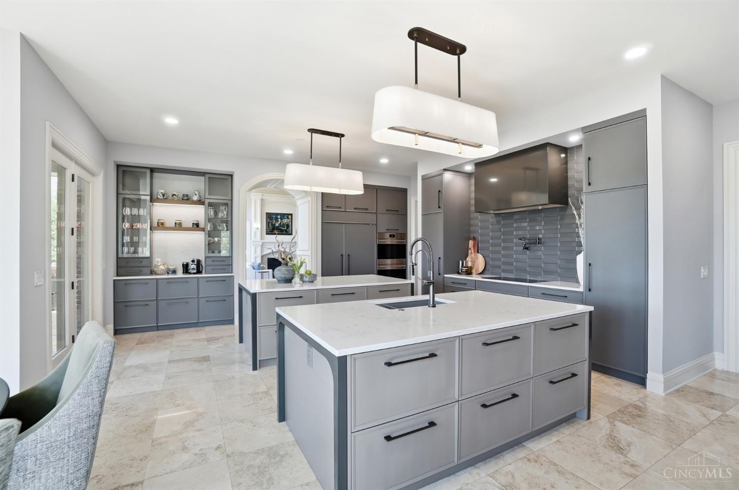 4535 Drake Road Cincinnati, OH 45243 - Photo 13 of 96 The beautifully updated kitchen is a true centerpiece, showcasing Wood-Mode cabinetry, Sub-Zero and Wolf appliances, quartz countertops, a large walk-in pantry, and designer fixtures.