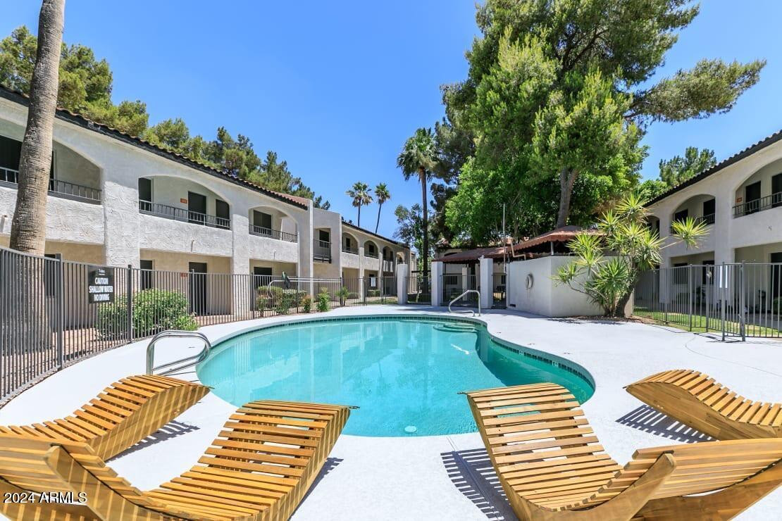 a view of a patio with swimming pool