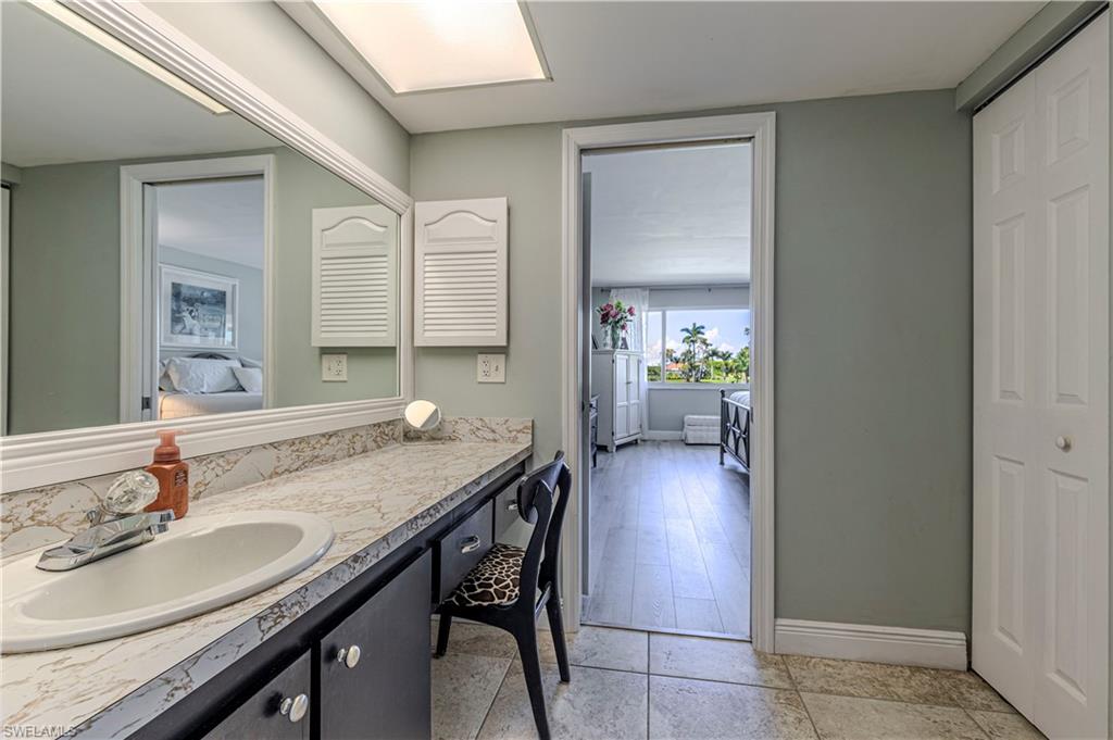 213 Memory Lane, Unit 4 Naples, FL 34112 - Photo 11 of 20 Bathroom with connected bathroom and vanity