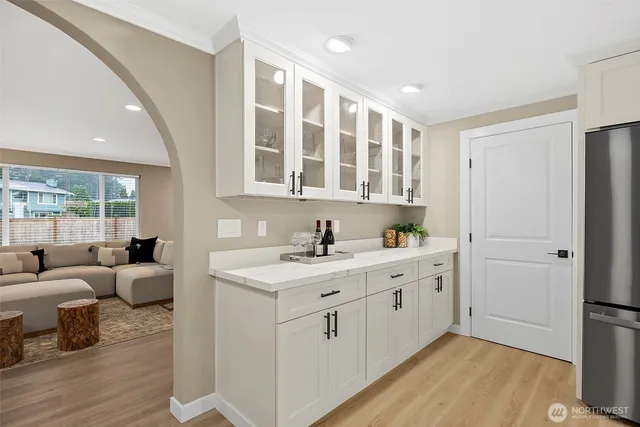 a spacious bathroom with a double vanity sink and a mirror