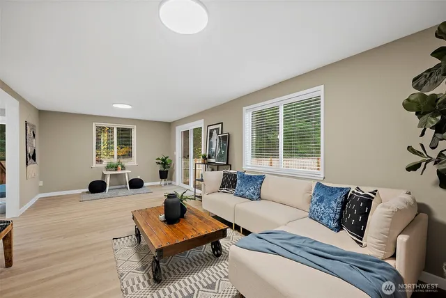 a living room with furniture and a window