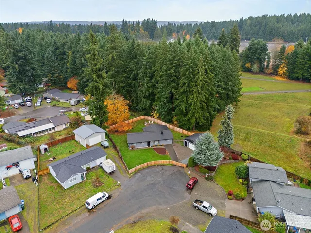 an aerial view of a house with outdoor space