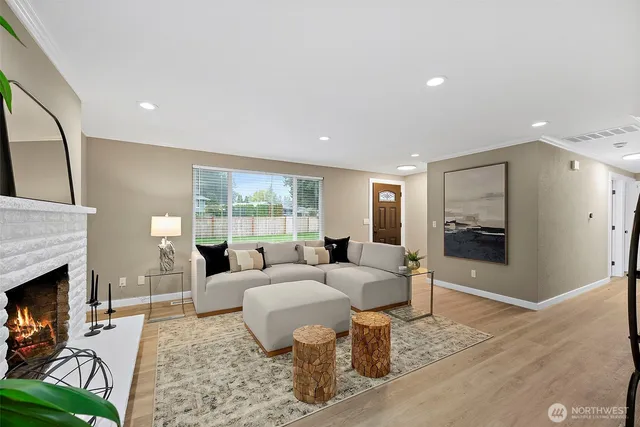 a living room with furniture and a fireplace