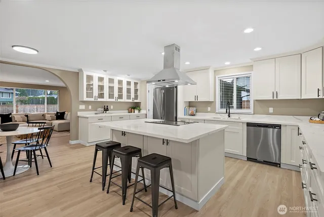 a kitchen with counter top space and appliances