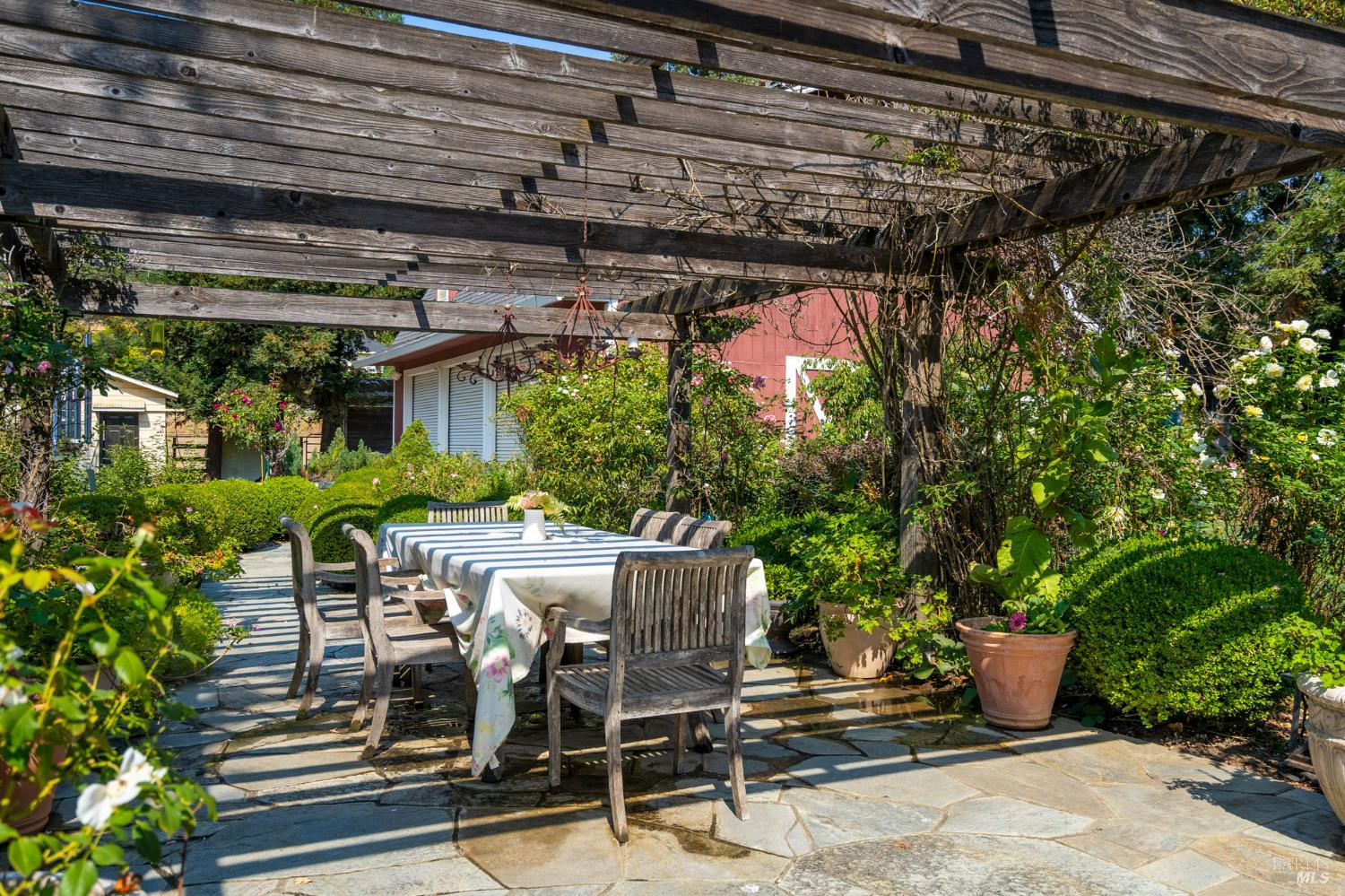 a view of a chairs and table in a patio