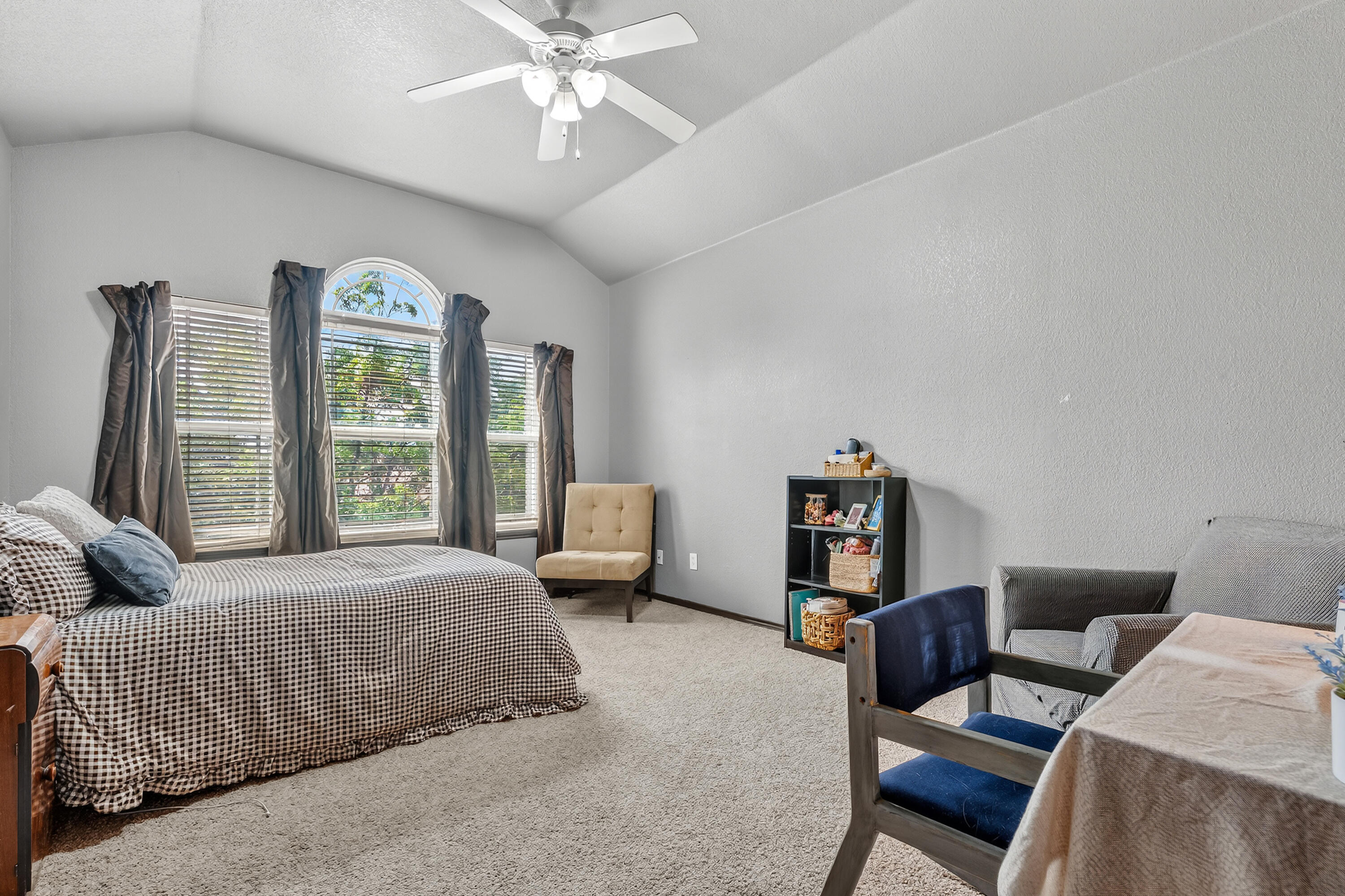 2602 112th Street Lubbock, TX 79423 - Photo 19 of 19 a bedroom with a bed furniture and a large window