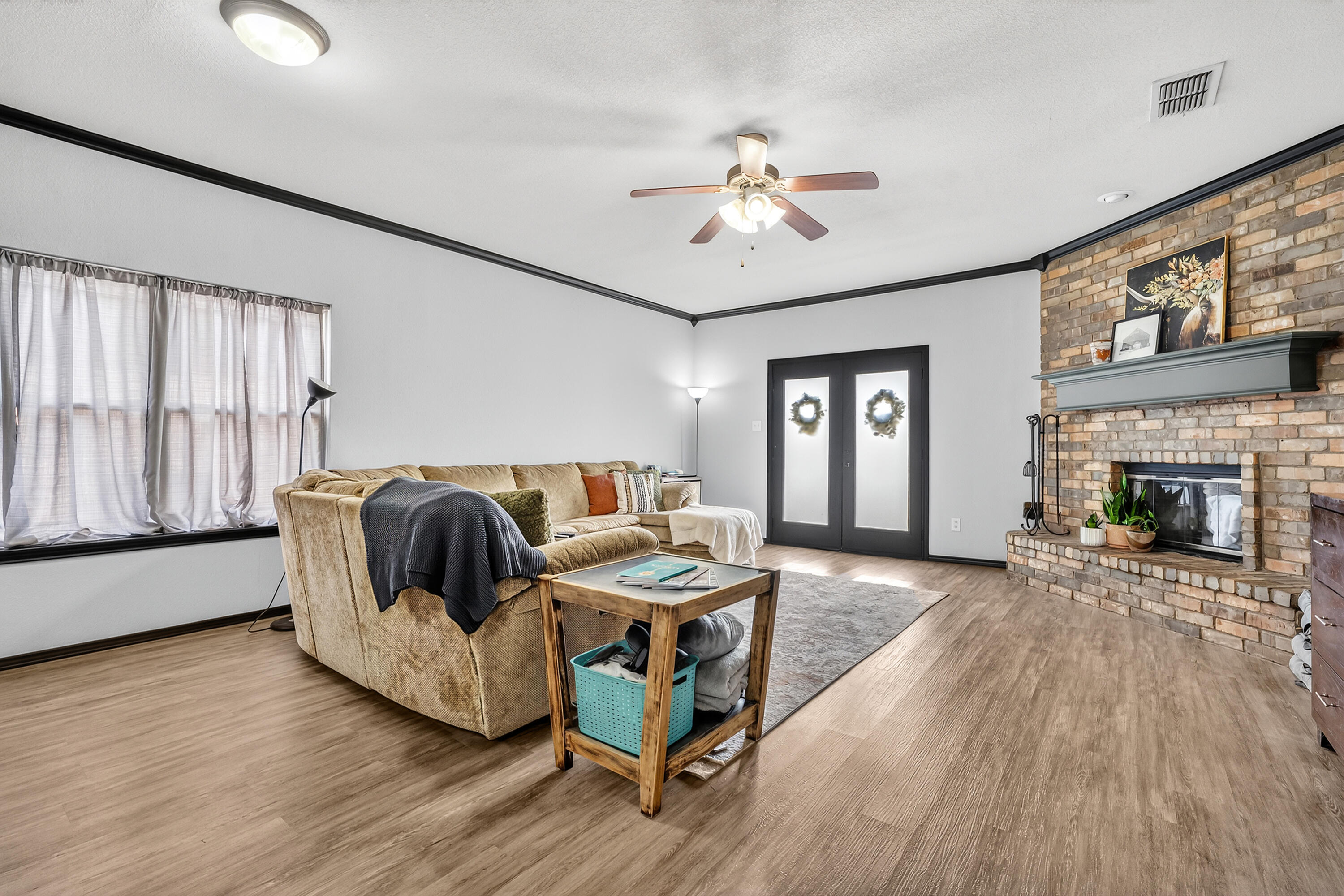 2602 112th Street Lubbock, TX 79423 - Photo 8 of 19 a living room with furniture and a fireplace
