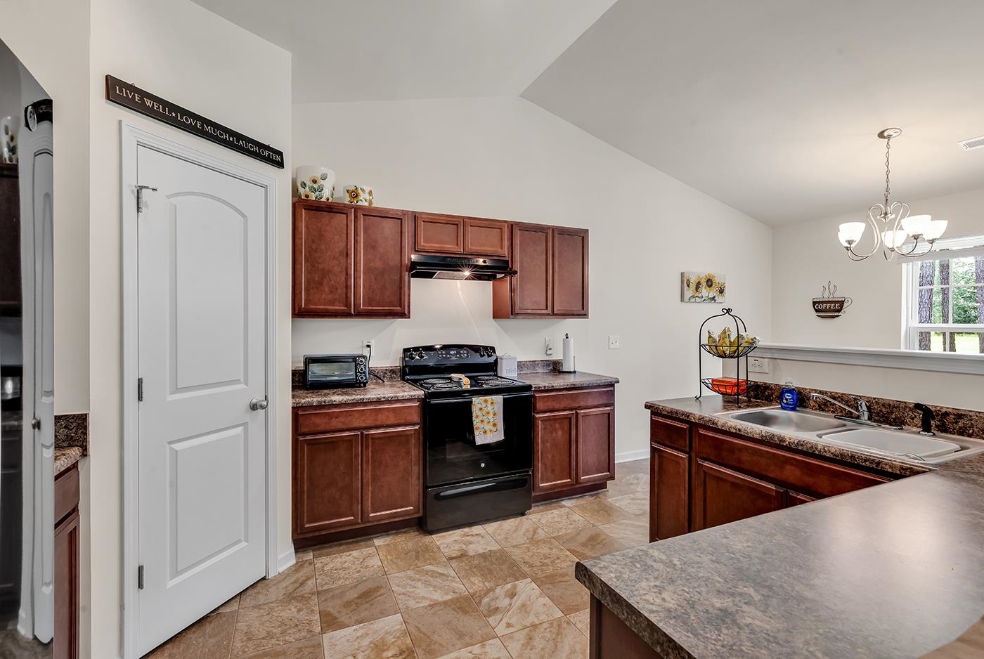 2009 Spring Valley Court Loris, SC 29569 - Photo 15 of 36 Kitchen featuring a chandelier, sink, black / elec