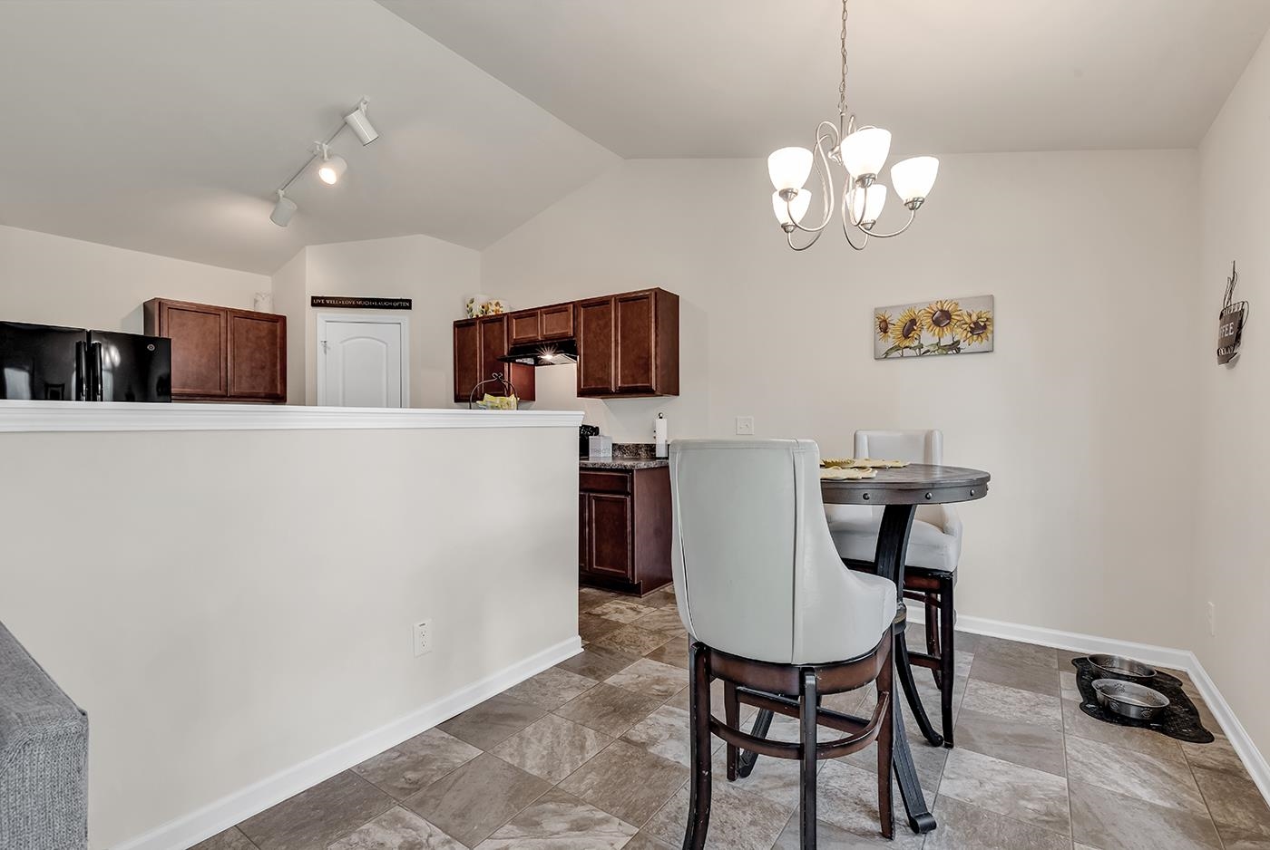 2009 Spring Valley Court Loris, SC 29569 - Photo 18 of 36 Tiled dining space with rail lighting, vaulted cei