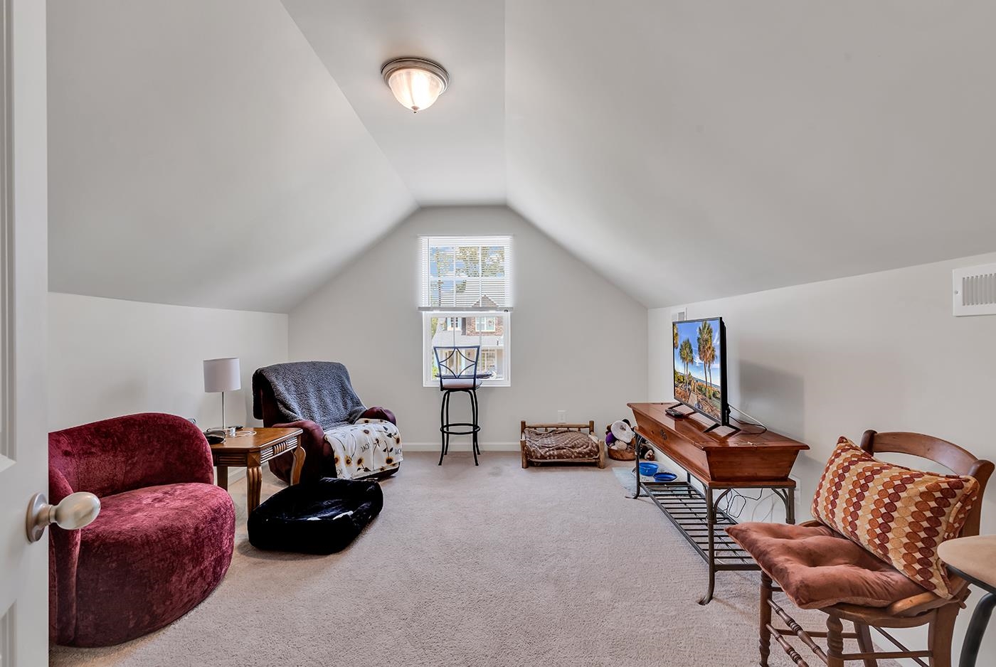 2009 Spring Valley Court Loris, SC 29569 - Photo 31 of 36 Living area with carpet flooring and lofted ceilin