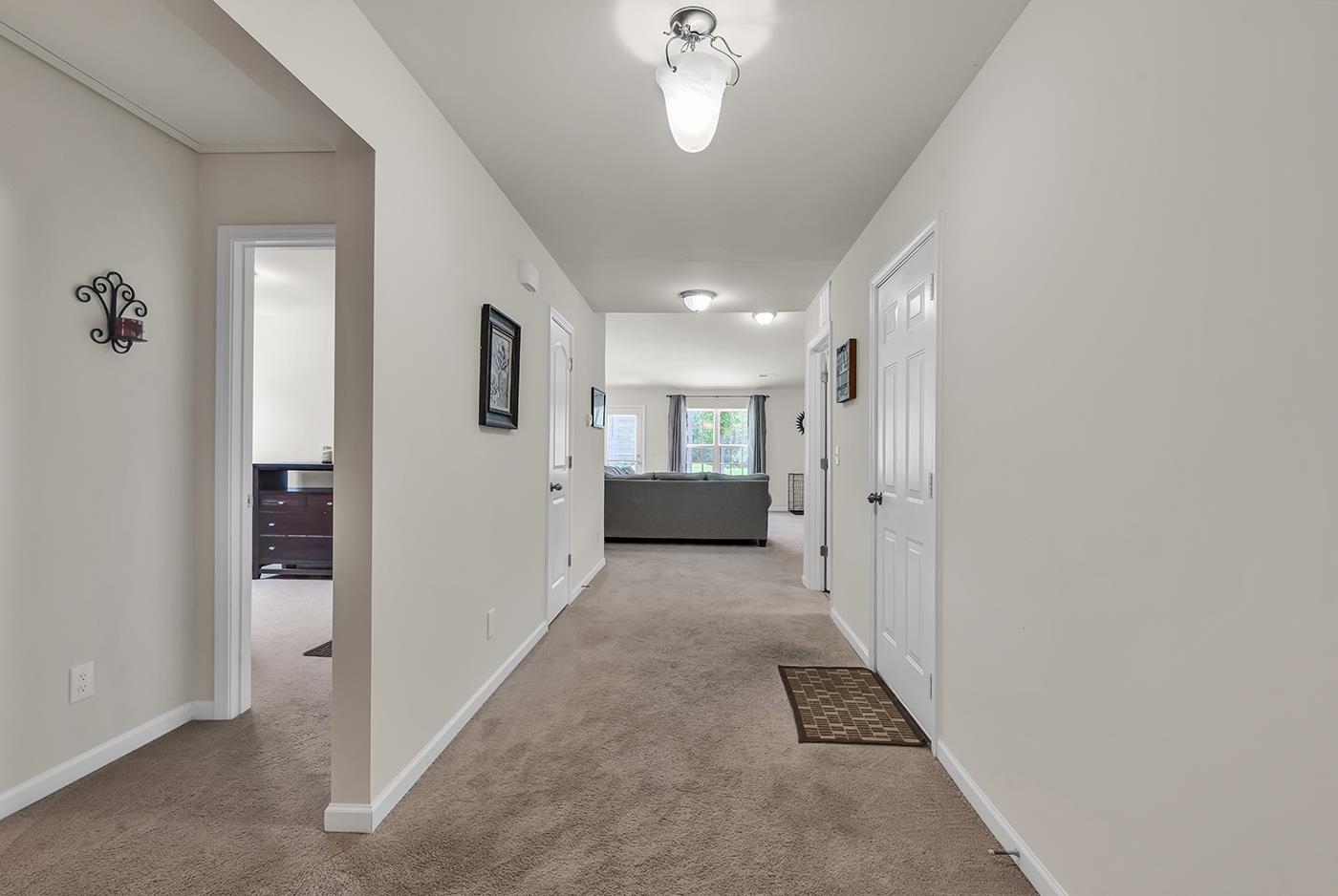 2009 Spring Valley Court Loris, SC 29569 - Photo 8 of 36 Hallway featuring light colored carpet