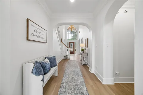 a large room with a large window and furniture