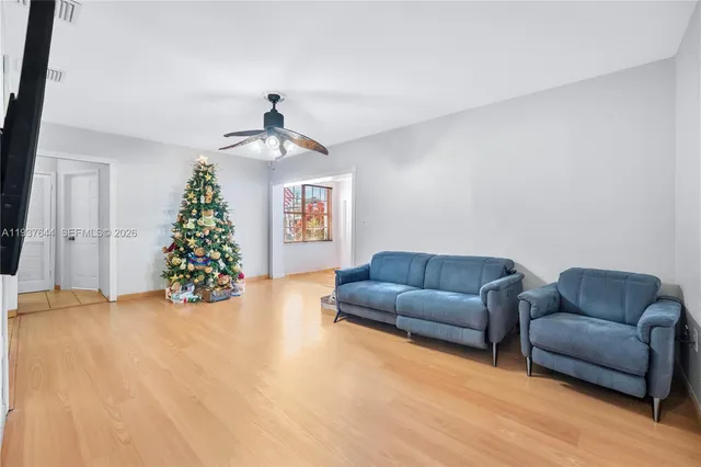 a living room with furniture and a window