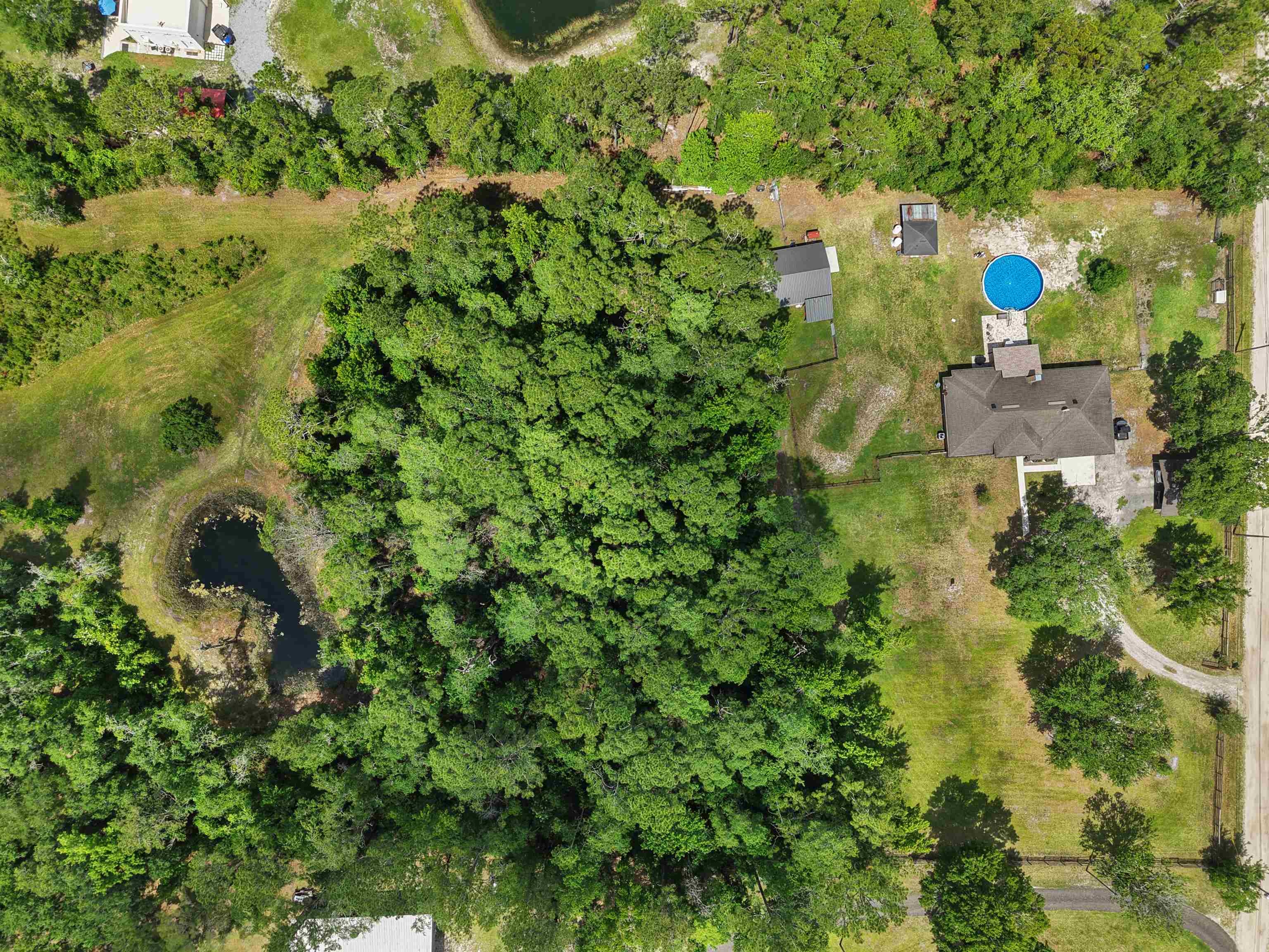 1805 Bennett Road St. Augustine, FL 32092 - Photo 54 of 65 an aerial view of residential house with outdoor space and trees all around