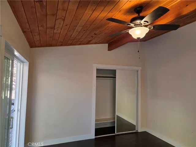 a view of a room with wooden floor and balcony