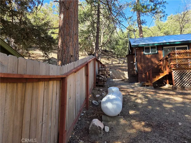 a view of a wooden house with a trees