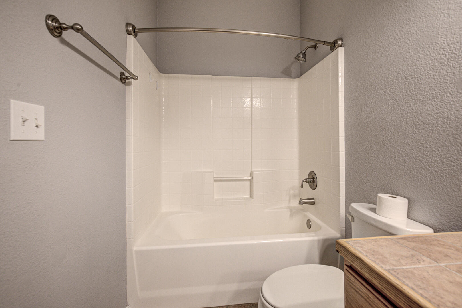 334 East Cedar Mill Road Star Valley, AZ 85541 - Photo 25 of 32 a bathroom with a granite countertop bathtub shower sink vanity and toilet