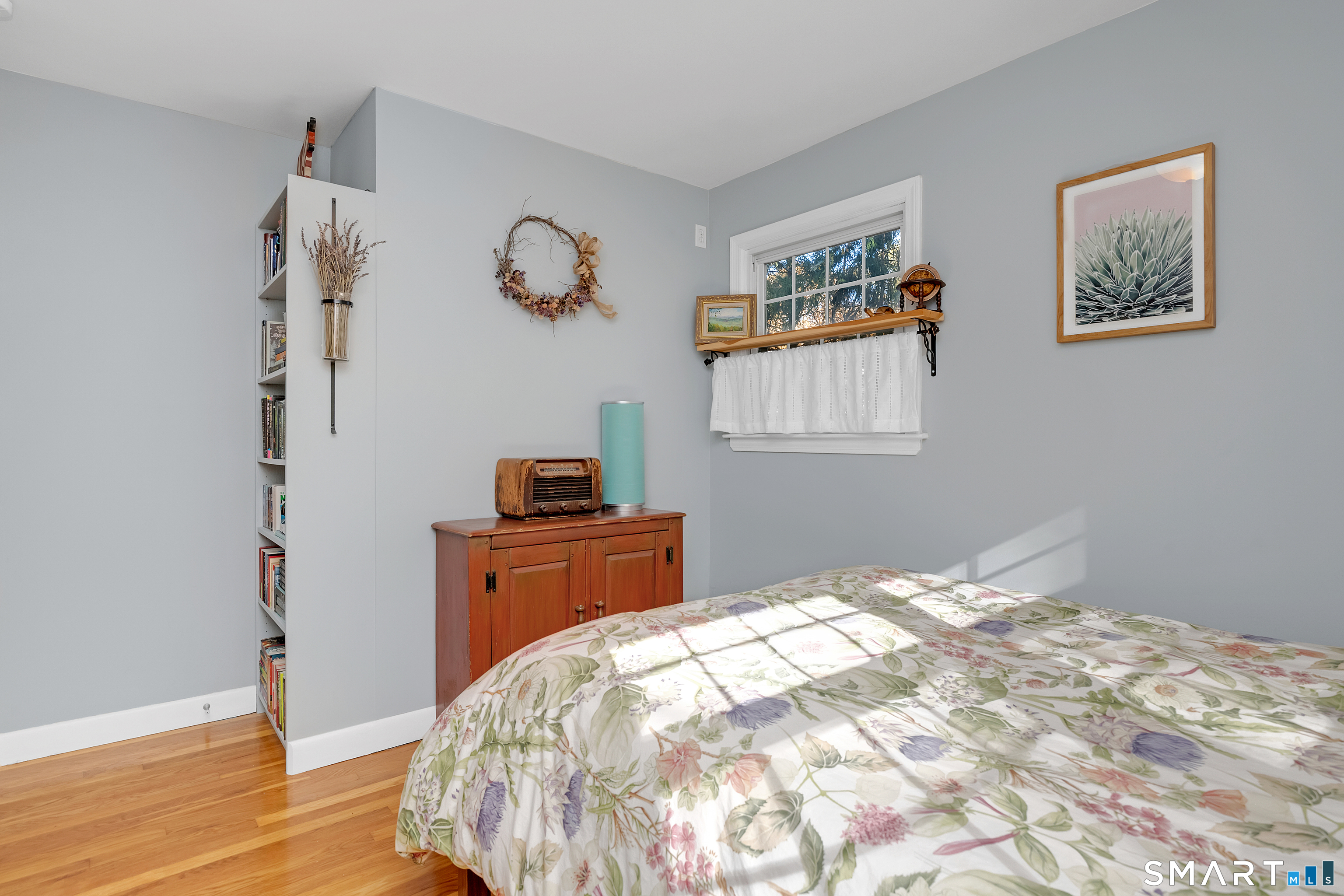 16 Marion Road Bethany, CT 06524 - Photo 24 of 40 a bedroom with a bed and wooden floor