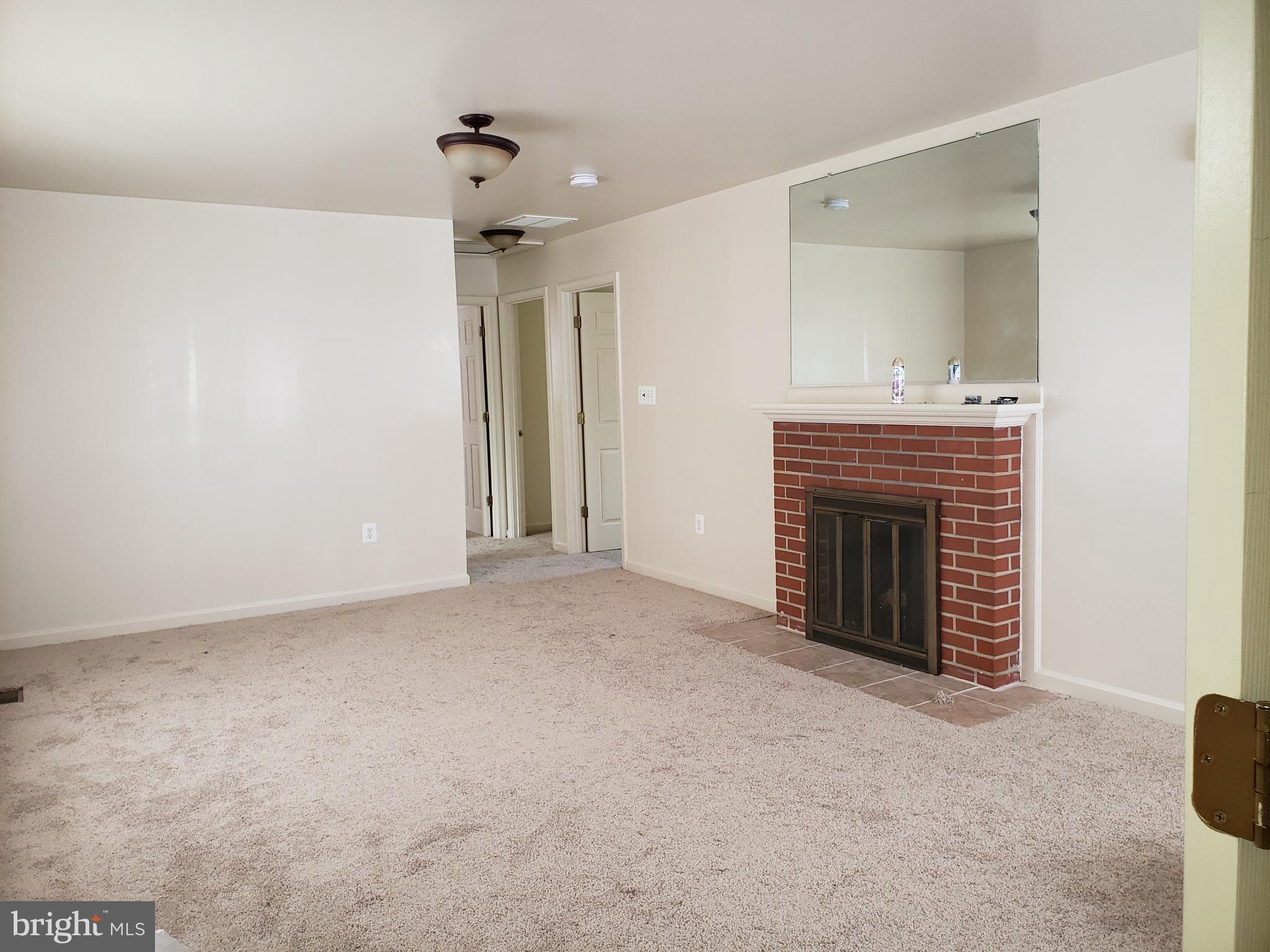 1618 Parham Road Silver Spring, MD 20903 - Photo 10 of 42 Living room with fireplace New carpet