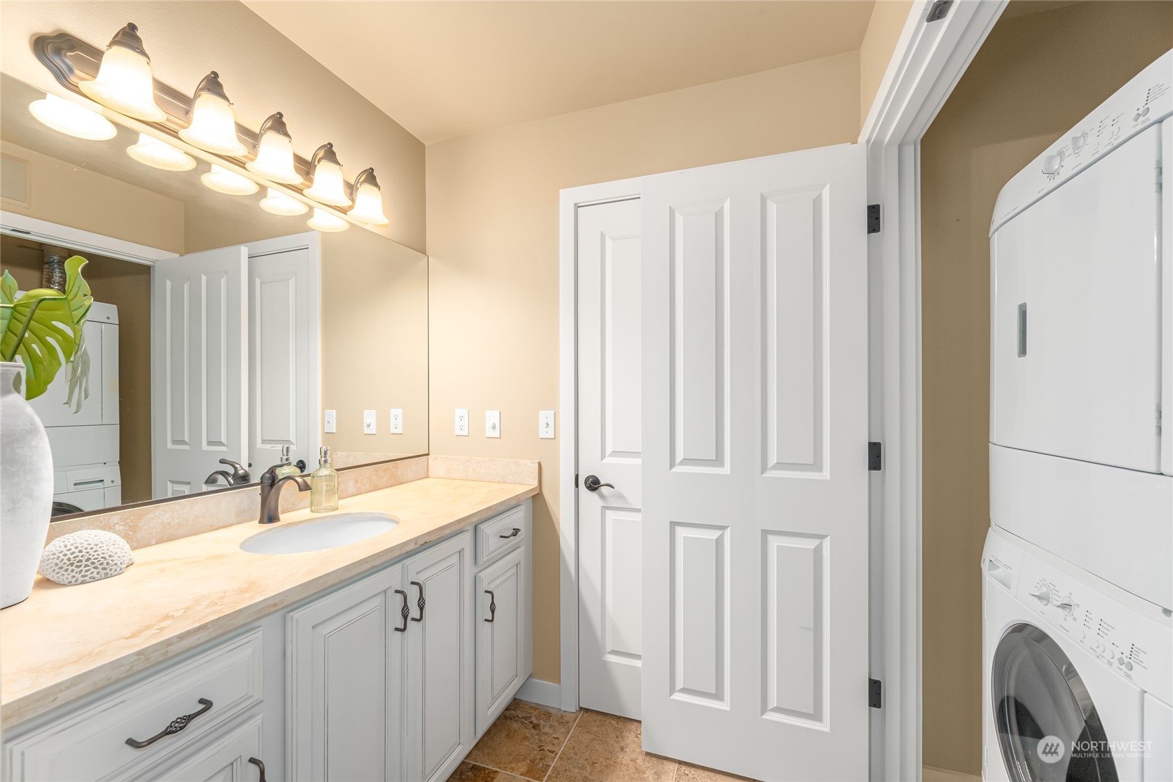 4116 California Avenue Southwest, Unit 313 Seattle, WA 98116 - Photo 12 of 18 a bathroom with a double vanity sink and a mirror