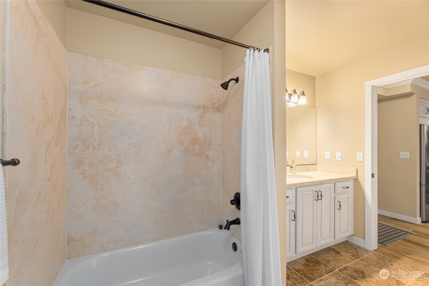 4116 California Avenue Southwest, Unit 313 Seattle, WA 98116 - Photo 13 of 18 a bathroom with a bathtub and shower