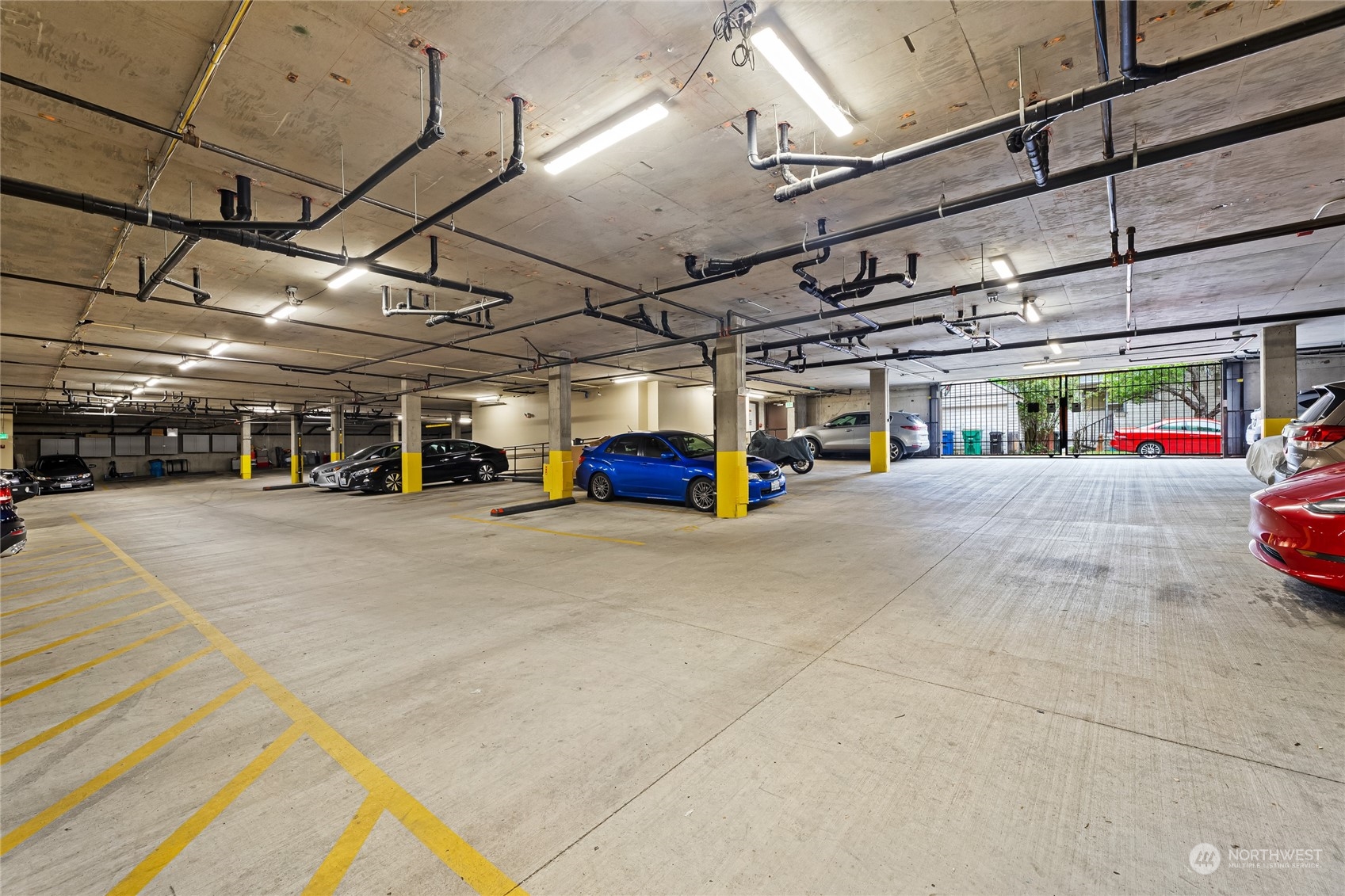 4116 California Avenue Southwest, Unit 313 Seattle, WA 98116 - Photo 18 of 18 a view of parking garage with cars