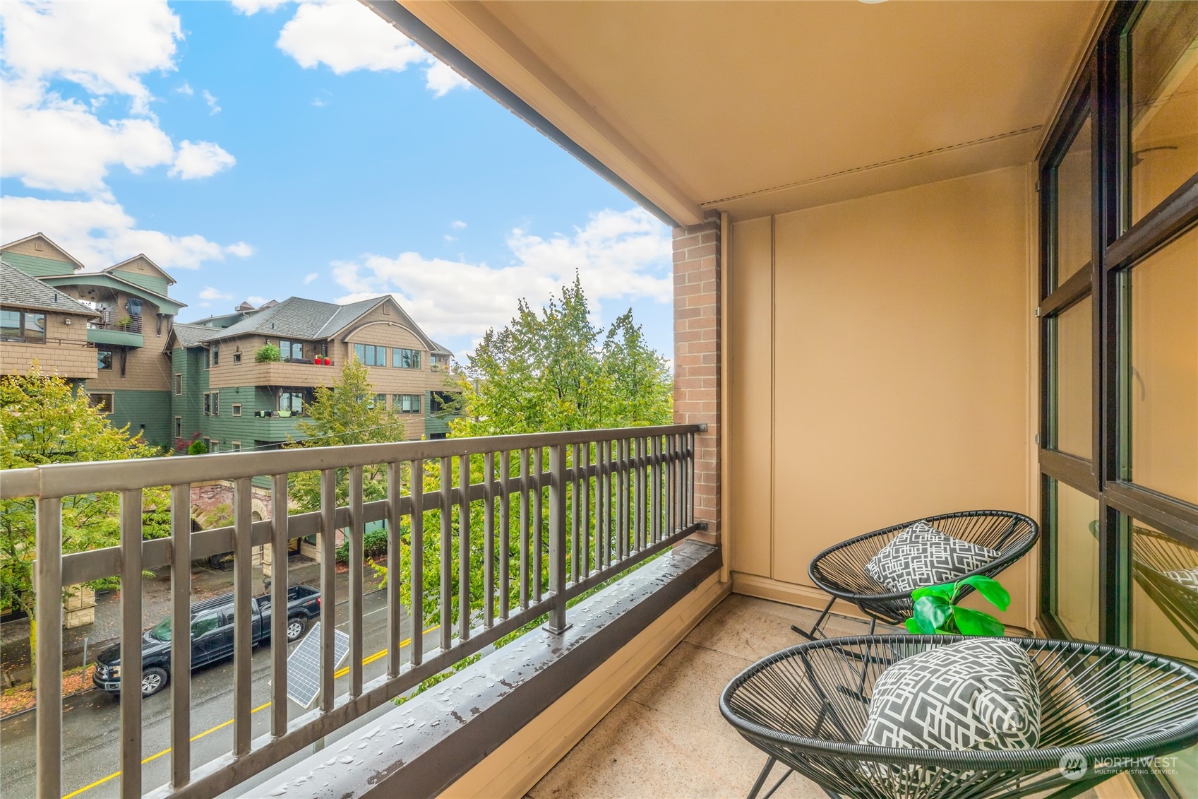4116 California Avenue Southwest, Unit 313 Seattle, WA 98116 - Photo 10 of 18 a balcony with table and chairs