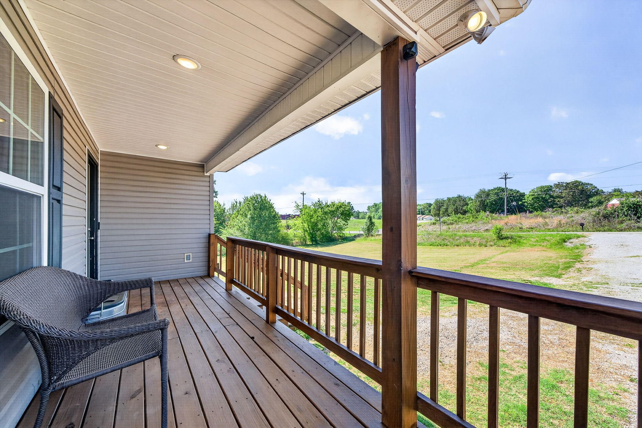144 Liberty Road Sparta, TN 38583 - Photo 2 of 24 a view of balcony with wooden floor and outdoor seating