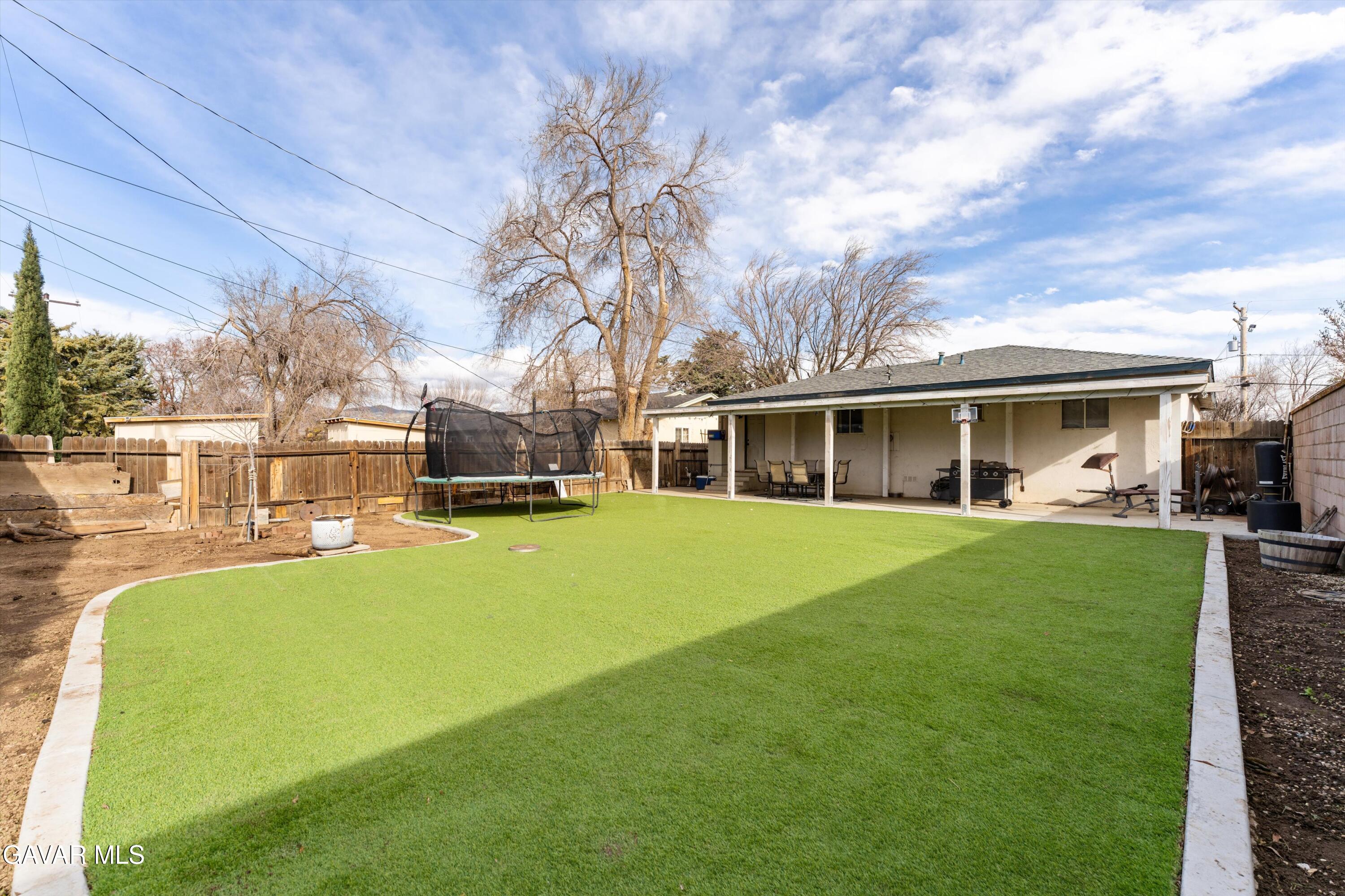 817 Oakwood Street Tehachapi, CA 93561 - Photo 11 of 12 front view of a house with a big yard
