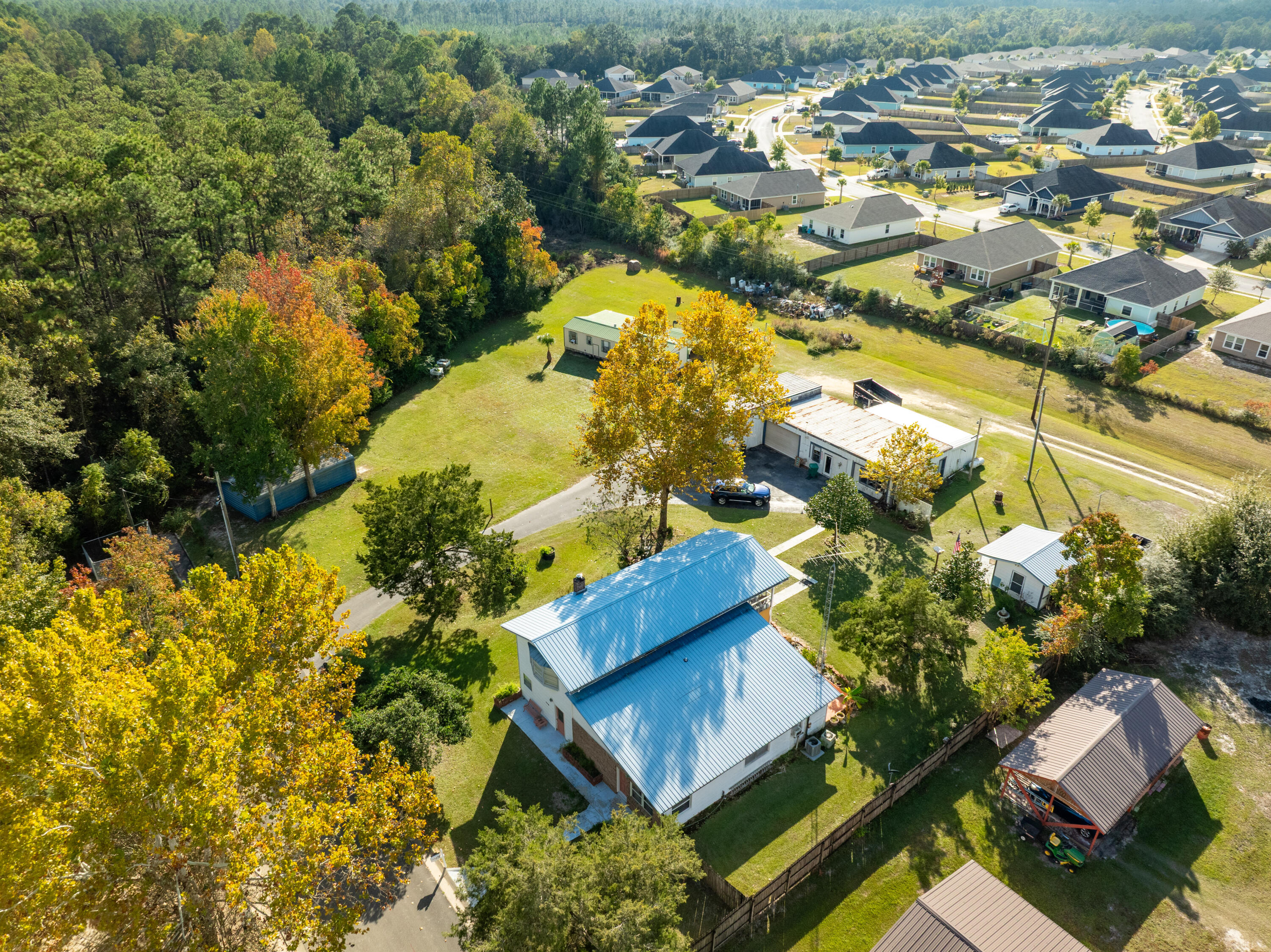 an aerial view of residential houses with outdoor space