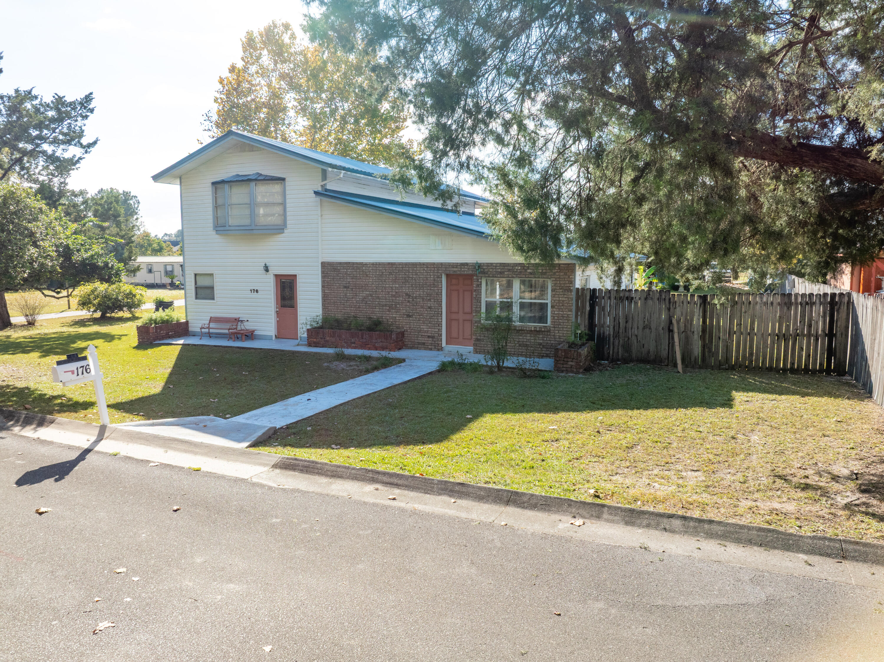 176 Bourbon Street Freeport, FL 32439 - Photo 11 of 15 a view of a backyard with a patio