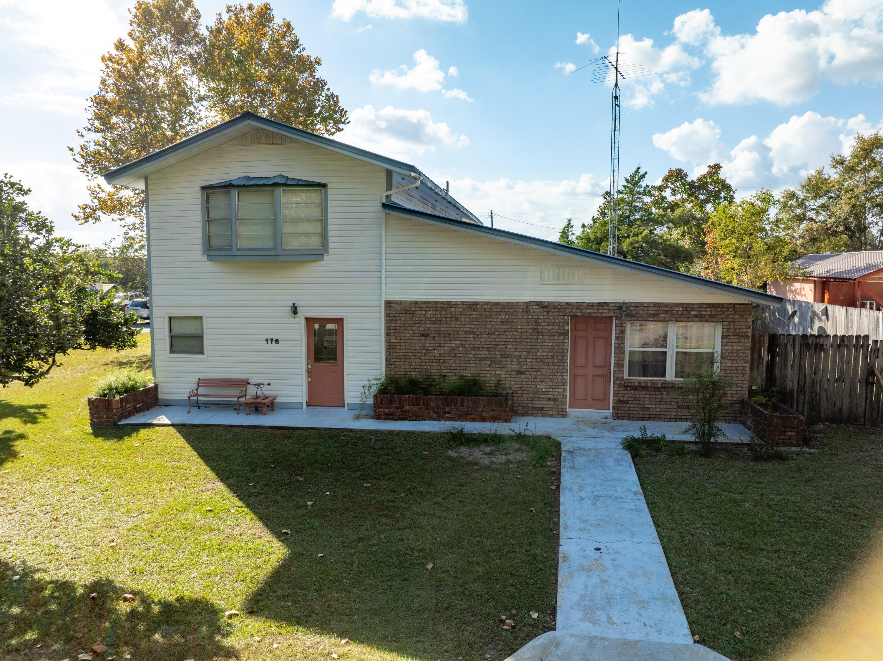 176 Bourbon Street Freeport, FL 32439 - Photo 12 of 15 a front view of a house with a yard