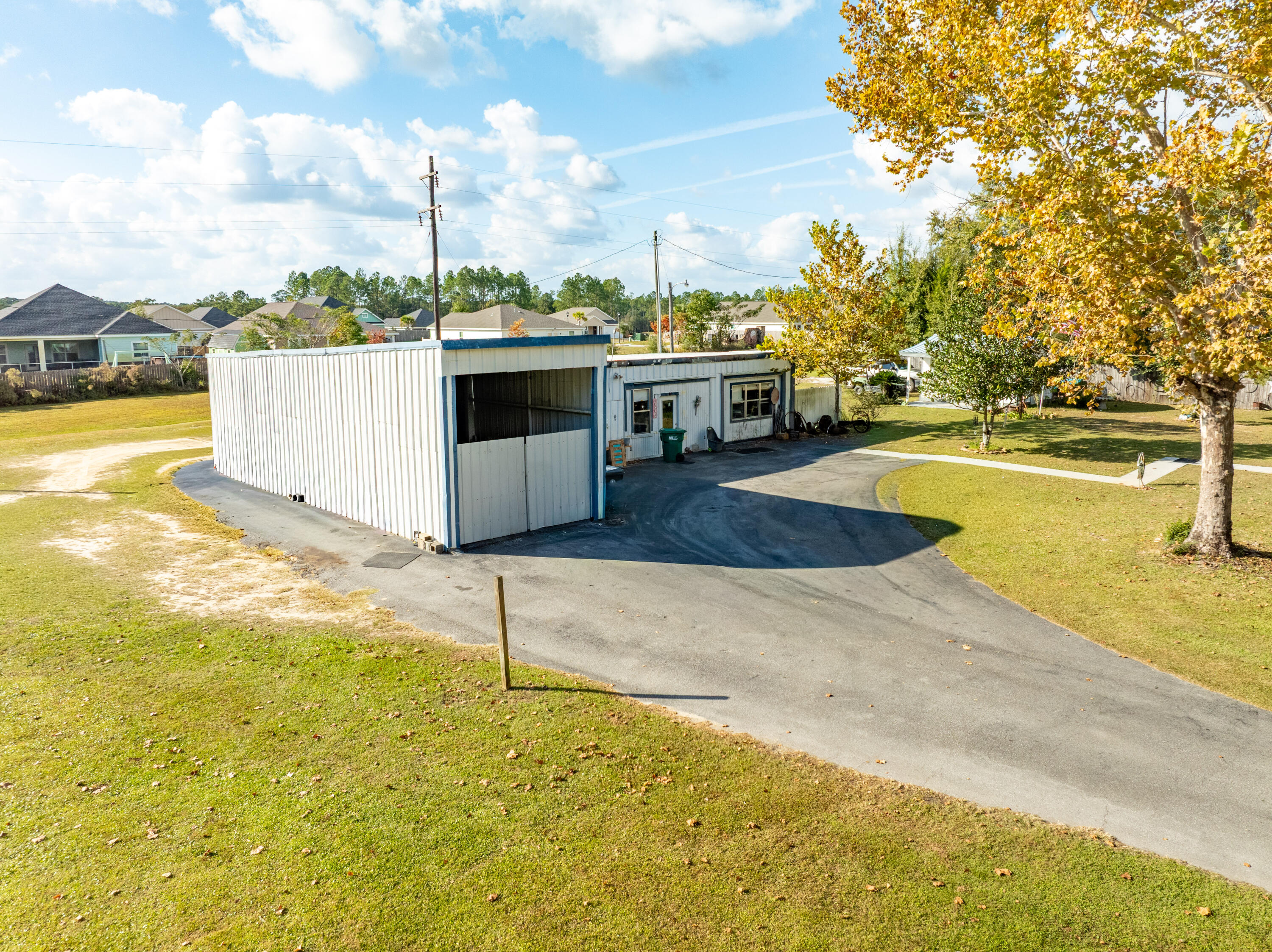 176 Bourbon Street Freeport, FL 32439 - Photo 7 of 15 a view of a swimming pool with an outdoor space and seating area