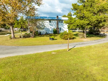 a view of a swimming pool with an outdoor space and seating area