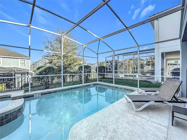 a spacious bathroom with a granite countertop tub sink a mirror and shower