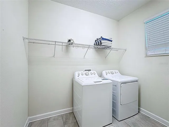 a room with furniture and a flat screen tv