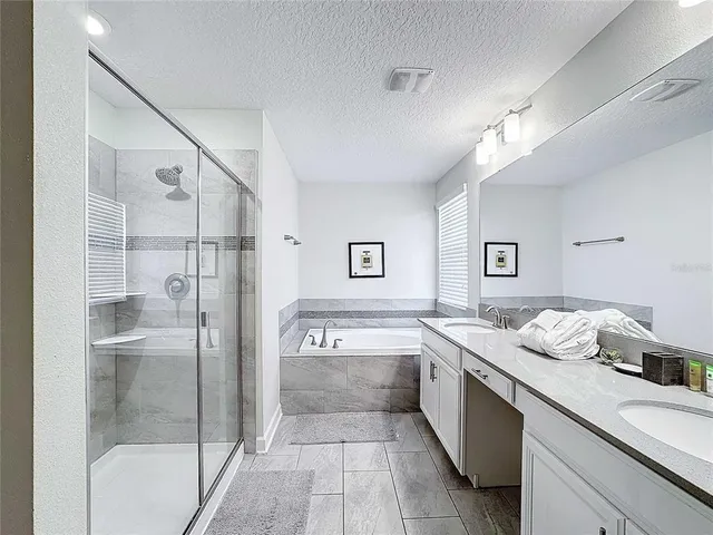 a bedroom with a bed and a television