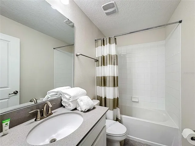 a bedroom with a bed and a cabinets