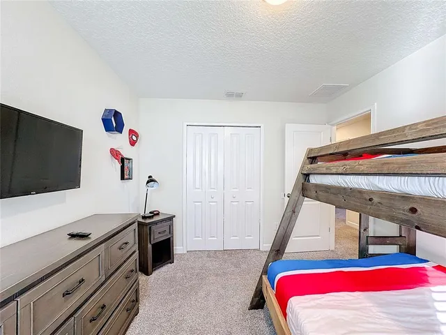 a en suite bathroom with a sink and a mirror