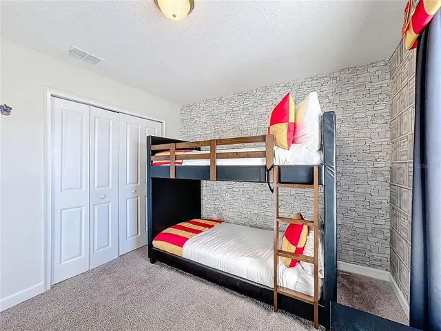 a view of a dining room with furniture wooden floor and chandelier