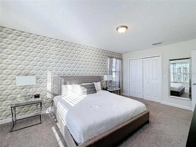 a room with gym equipment and a flat screen tv