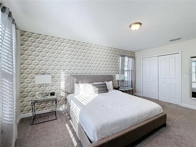 a swimming pool with outdoor seating and yard