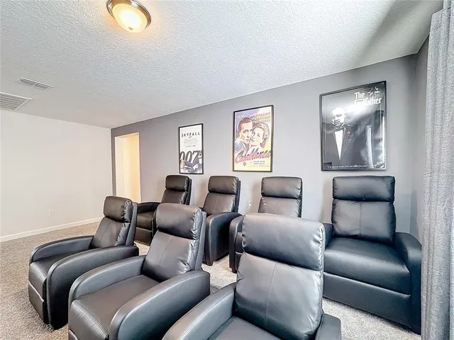 a view of a lake with houses in the back