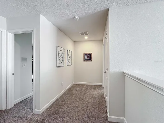 a view of swimming pool from a lounge chair