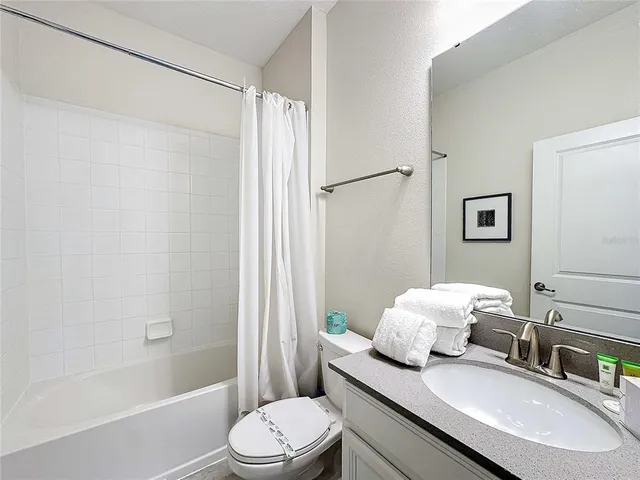 a view of a swimming pool with a lounge chairs