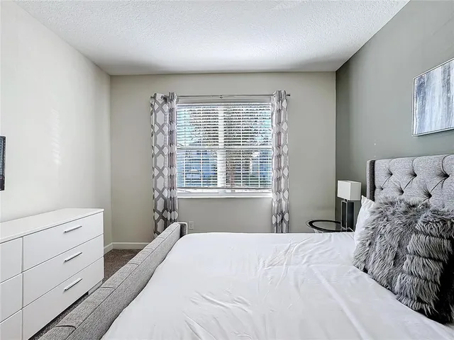 a room with lots of furniture and air hockey table